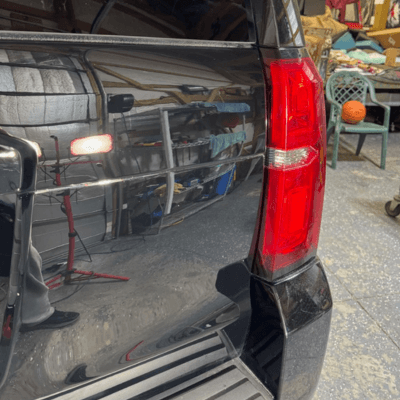 Gray car finish after detailing and coating showing liquid style finish and no scratches.