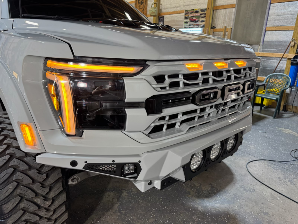 White Ford Raptor Truck Grill after a complete exterior detail | Mystic Auto Detailing