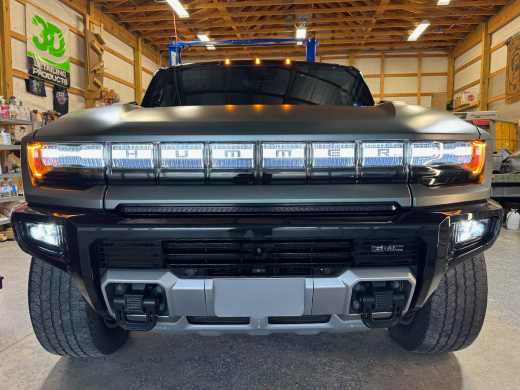 Hummer in a Garage after being washed and detailed. Mystic AC Detailing