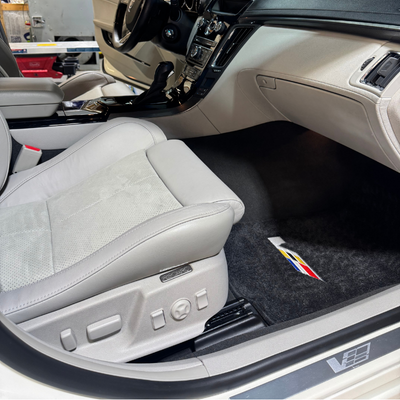Passenger side of white cadillac after a full service detail
