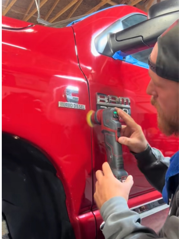 Mystic Auto Body | Harley buffing a Red Truck.